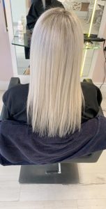 woman with long straight platinum hair